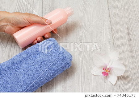 Women perfumers and cosmetics on a wooden background. Women perfumers and cosmetics on a wooden background. 74346175