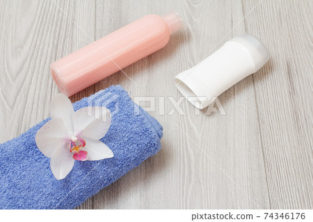 Women perfumers and cosmetics on a wooden background. Women perfumers and cosmetics on a wooden background. 74346176