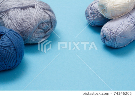 Woolen yarn for knitting. Balls of natural wool yarn. Woolen yarn for knitting. Balls of natural wool yarn. 74346205