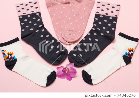 Women socks on pink background. Top view. Women socks on pink background. Top view. 74346276