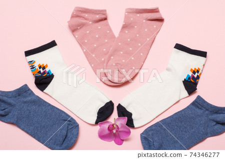 Women socks on pink background. Top view. Women socks on pink background. Top view. 74346277