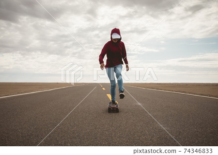 Asian woman skateboarder skateboarding in the wide world 74346833