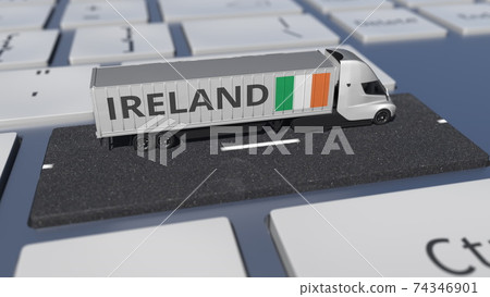 Truck with flag of Ireland moves on the keyboard key. Export or import related 3d rendering Truck with flag of Ireland moves on the keyboard key. Export or import related 3d rendering 74346901
