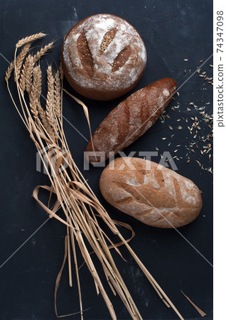 Flat lay bread background. Freshly baked assortment of bread. Flat lay bread background. Freshly baked assortment of bread. 74347098