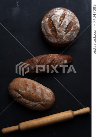 Flat lay bread background. Freshly baked assortment of bread. Flat lay bread background. Freshly baked assortment of bread. 74347099