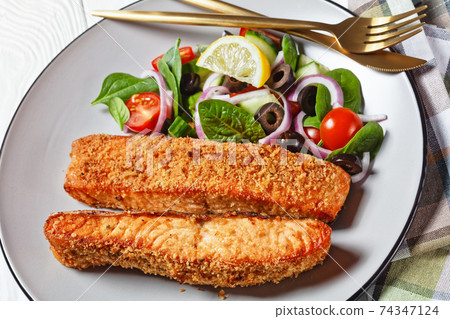 Panko crusted baked salmon fillets, veggies salad 74347124