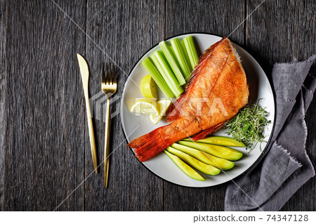 cold smoked red snapper on a plate cold smoked red snapper on a plate 74347128