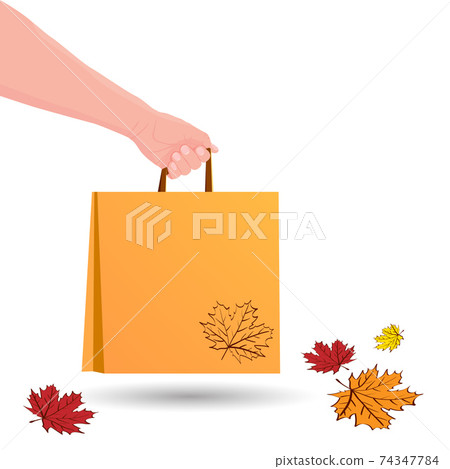 Hand holds shopping bag. Food delivery in paper packet. Shopping or gift bag. Eco Bag mockup Isolated on white background. Autumn sale concept. Colorful leaves. Vector illustration. 74347784