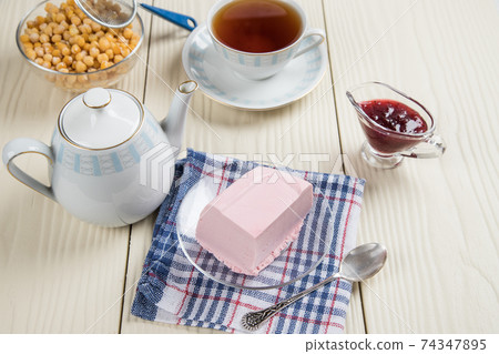 Tea party with homemade jelly made from Aquafaba and berries. Healthy dessert substitute with plant-based protein from chickpeas 74347895