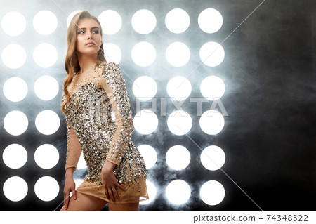beautiful blonde woman in elegant sequin dress 74348322