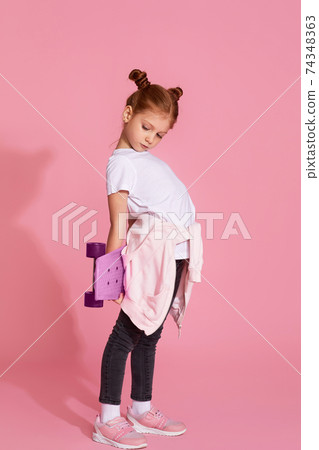 adorable little child girl with skateboard 74348363