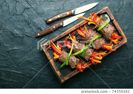 Meat rolls with bell pepper 74350381
