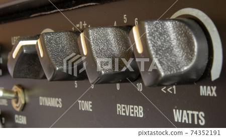 Buttons, knobs and lights of a guitar amplifier Buttons, knobs and lights of a guitar amplifier 74352191
