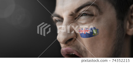 A screaming man with the image of the British Virgin Islands national flag on his face A screaming man with the image of the British Virgin Islands national flag on his face 74352215