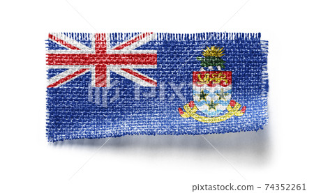 Cayman Islands flag on a piece of cloth on a white background Cayman Islands flag on a piece of cloth on a white background 74352261