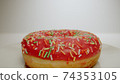MACRO: Sweet pink donut lies on a white dish, Motion 74353105