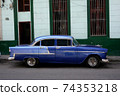 Backstreet in Havana, Cuba with old car 74353218