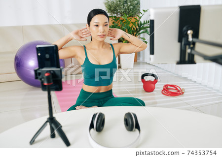 Sportswoman conducting online class Sportswoman conducting online class 74353754