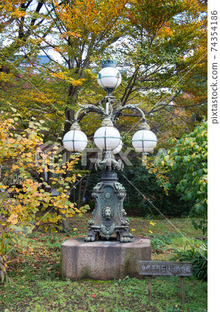 Autumn leaves scenery with Japanese garden in Japan Autumn leaves scenery with Japanese garden in Japan 74354186