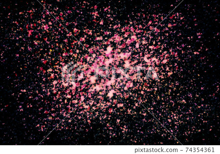 Pink watercolor splash on black background 74354361