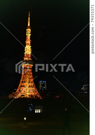 Tokyo Tower illuminated at night 74355371