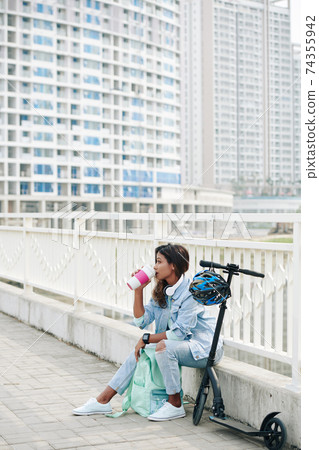 Pensive woman drinking coffee 74355942