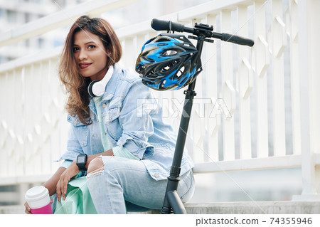 Woman resting with cup of coffee Woman resting with cup of coffee 74355946
