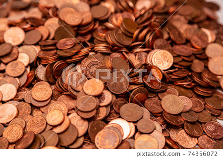 Many small euro coins lie on each other Many small euro coins lie on each other 74356072