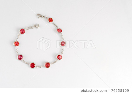 Fashion pink sapphire bracelet on white background.Pink gemstones in white gold, jewelry theme. Fashion pink sapphire bracelet on white background.Pink gemstones in white gold, jewelry theme. 74358109