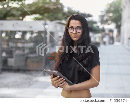 Woman With Tablet Pc Outdoors in the City Woman With Tablet Pc Outdoors in the City 74359874