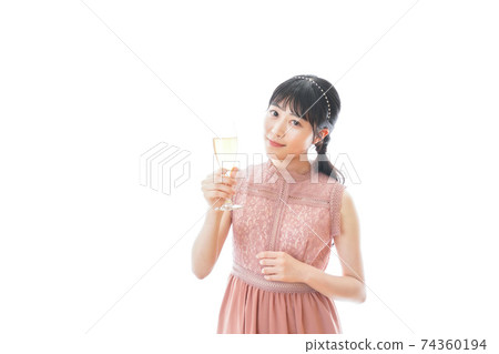 Young woman drinking wine at a party 74360194