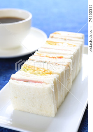 Delicious mixed sandwiches and coffee Delicious mixed sandwiches and coffee 74360552