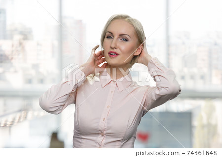 Caucasian businesswoman admires herself. Caucasian businesswoman admires herself. 74361648