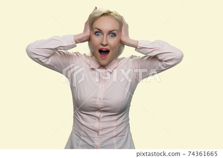 Surprised businesswoman is holding her head. Surprised businesswoman is holding her head. 74361665