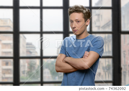 Unhappy boy with crossed arms. Unhappy boy with crossed arms. 74362092