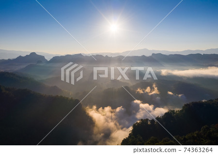 Aerial view of beautiful mountain morning mist Aerial view of beautiful mountain morning mist 74363264