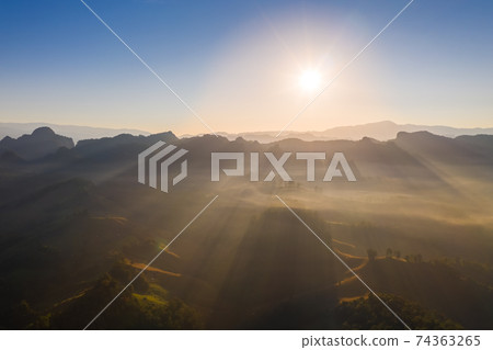 Aerial view of beautiful mountain morning mist Aerial view of beautiful mountain morning mist 74363265