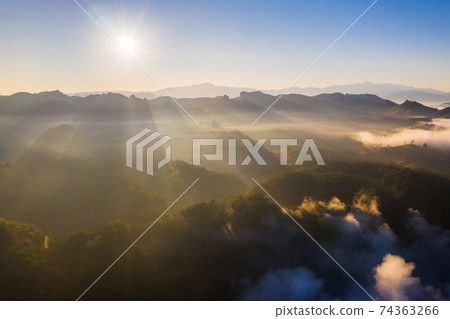Aerial view of beautiful mountain morning mist Aerial view of beautiful mountain morning mist 74363266