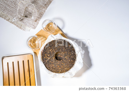 Chinese puer fermented and pressed tea. Healthy nutrition and antioxidant drinks. space for text. flat lay Chinese puer fermented and pressed tea. Healthy nutrition and antioxidant drinks. space for text. flat lay 74363368