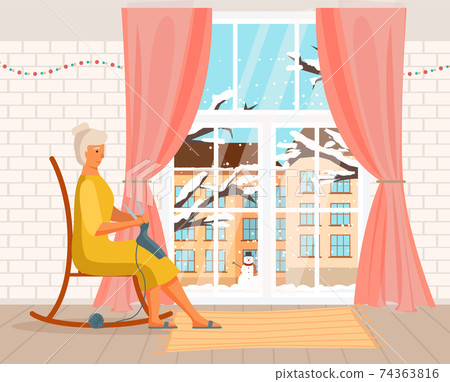 Elderly woman is knitting a scarf and looking out the window in winter. Person works with threads 74363816