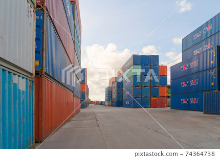 Shipping container site loading by crane in logistic port warehouse storage factory manufacturing business transportation import and export goods of freight business carrier. 74364738