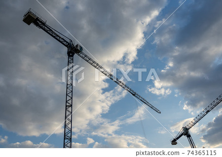 Close-up of cranes against the blue sky Close-up of cranes against the blue sky 74365115