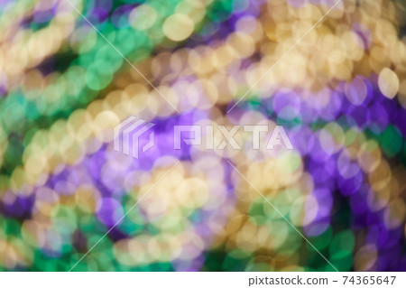 Colorful blurred background with bokhe effect for Mardi gras. Real photo. 74365647