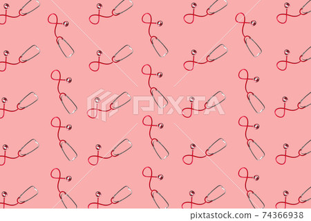 Red stethoscopes on soft pink background. Medical equipment. Red stethoscopes on soft pink background. Medical equipment. 74366938