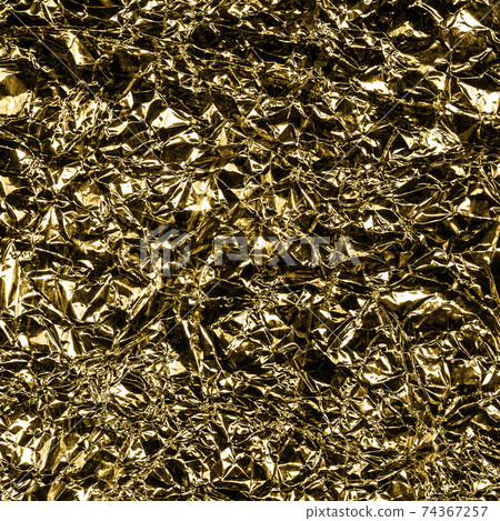 Golden foil background with shiny crumpled surface for texture background. Iridescent surface wrinkled foil Golden foil background with shiny crumpled surface for texture background. Iridescent surface wrinkled foil 74367257