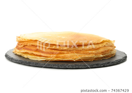 Tray with thin pancakes isolated on white background 74367429