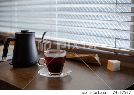 Coffee in a drip kettle and glass mug (horizontal) Coffee in a drip kettle and glass mug (horizontal) 74367537