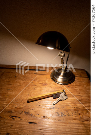 Key (vertical) on an antique desk Key (vertical) on an antique desk 74367564