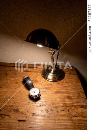 Watch on an antique desk (vertical) 74367565