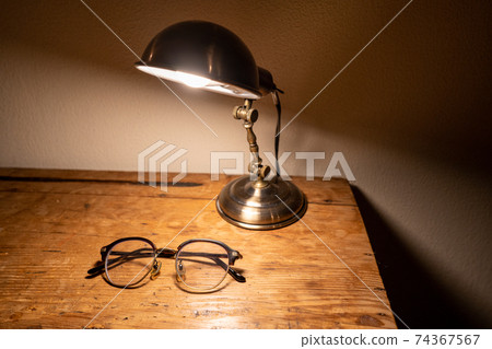 Glasses on an antique desk (horizontal) 74367567